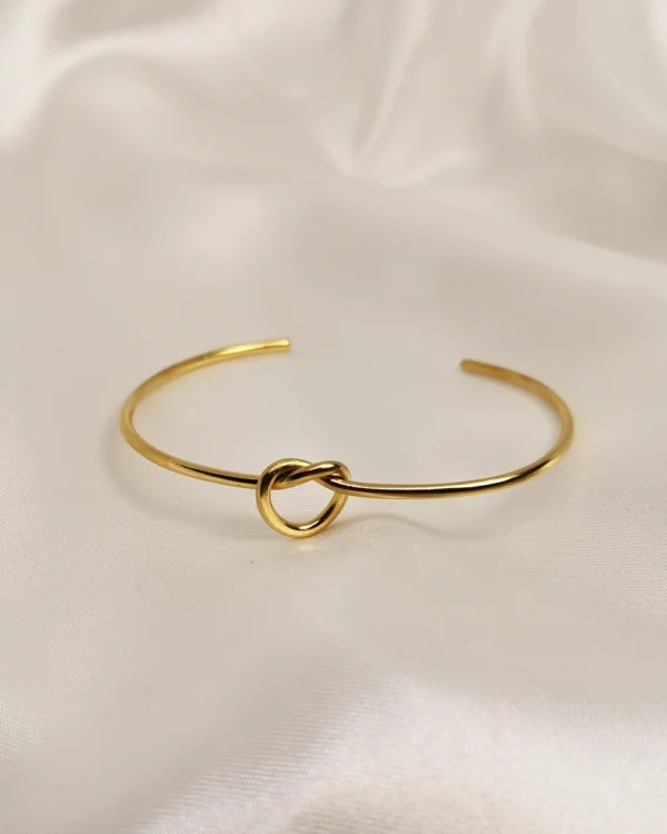 Βραχιόλι χειροπέδα κόμπος χρυσό